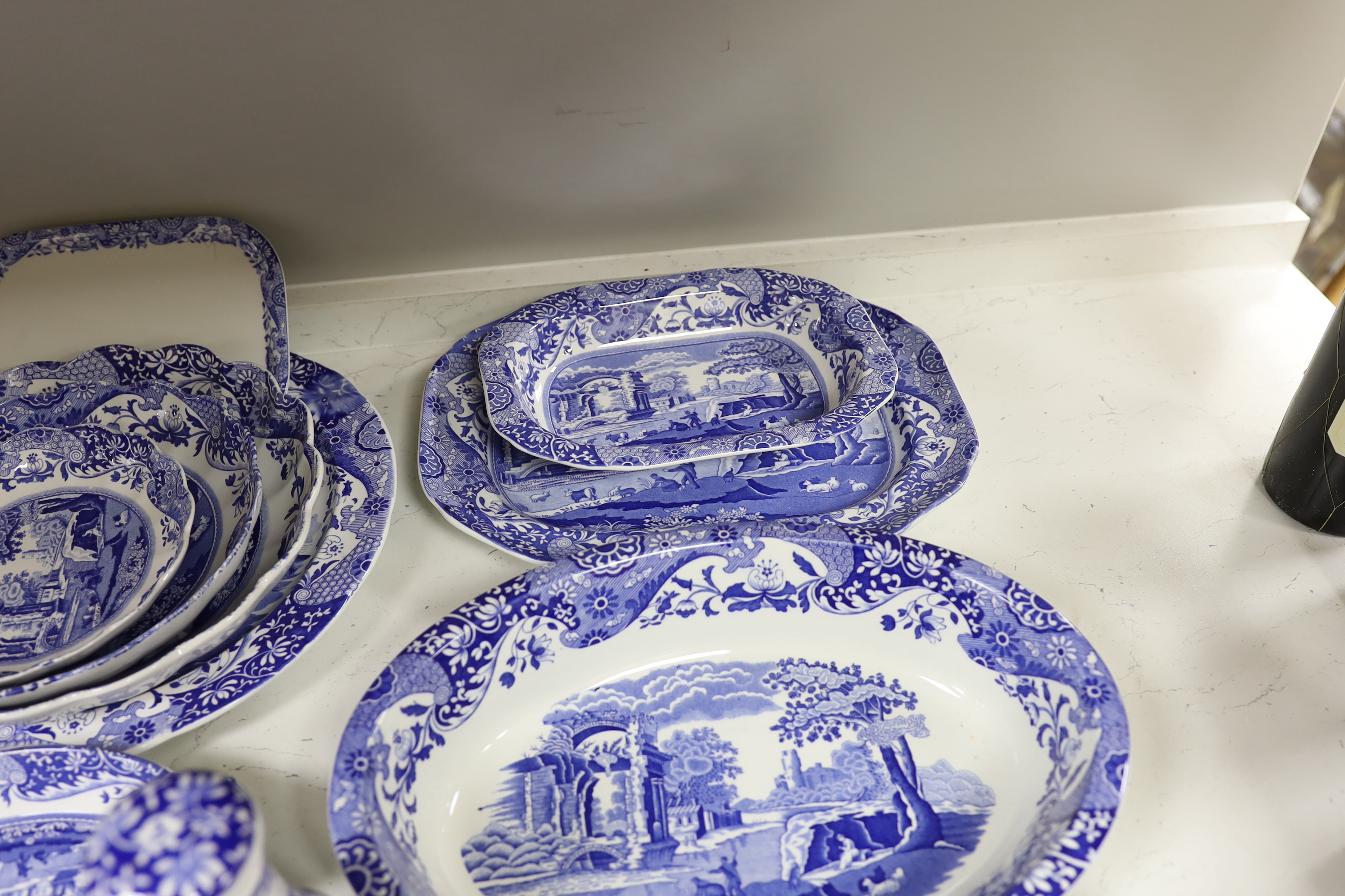 A collection of Spode Italian blue and white various sized serving dishes, cruets etc